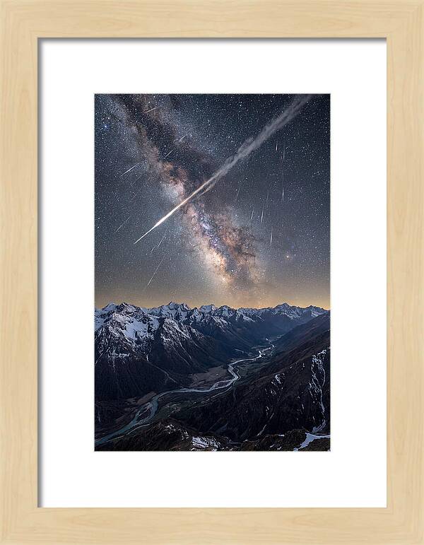 Celestial Dance Above Rugged Peaks