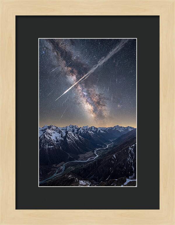 Celestial Dance Above Rugged Peaks