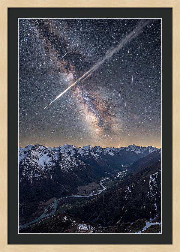 Celestial Dance Above Rugged Peaks