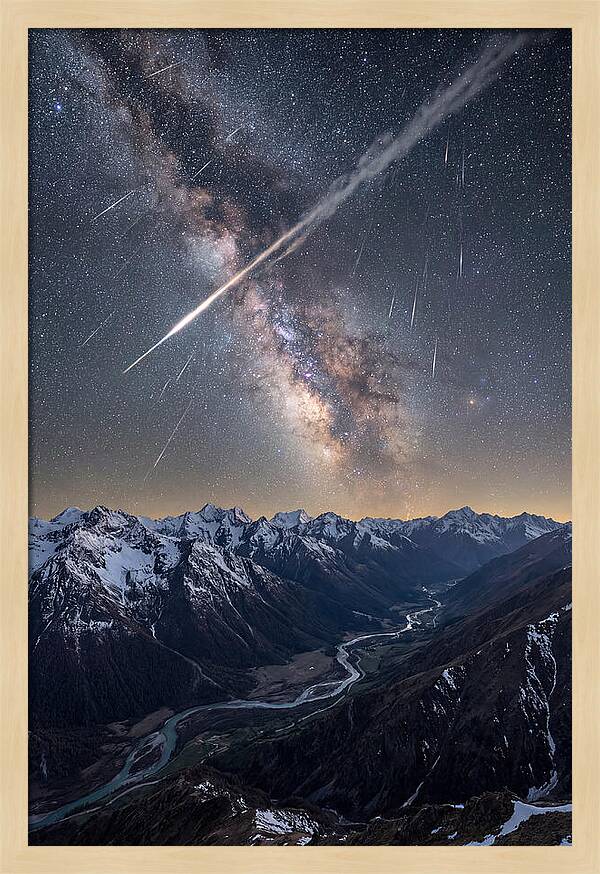 Celestial Dance Above Rugged Peaks