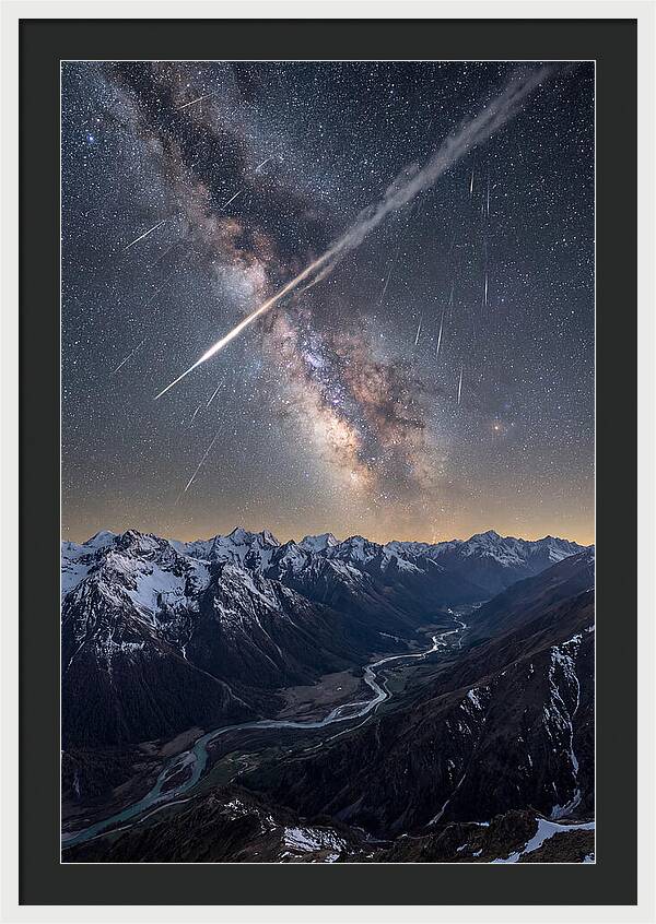 Celestial Dance Above Rugged Peaks