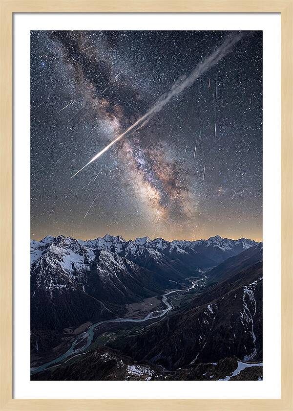 Celestial Dance Above Rugged Peaks