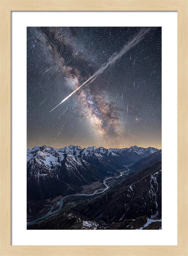 Celestial Dance Above Rugged Peaks