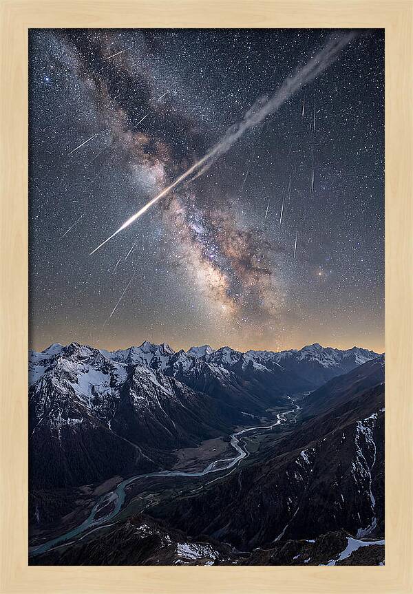 Celestial Dance Above Rugged Peaks