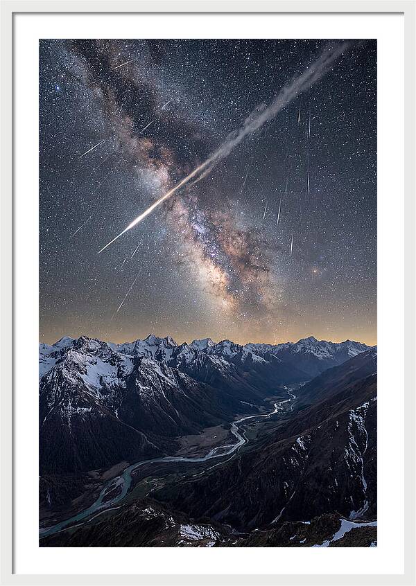 Celestial Dance Above Rugged Peaks