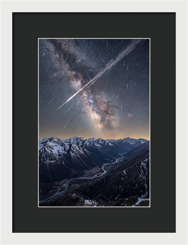 Celestial Dance Above Rugged Peaks