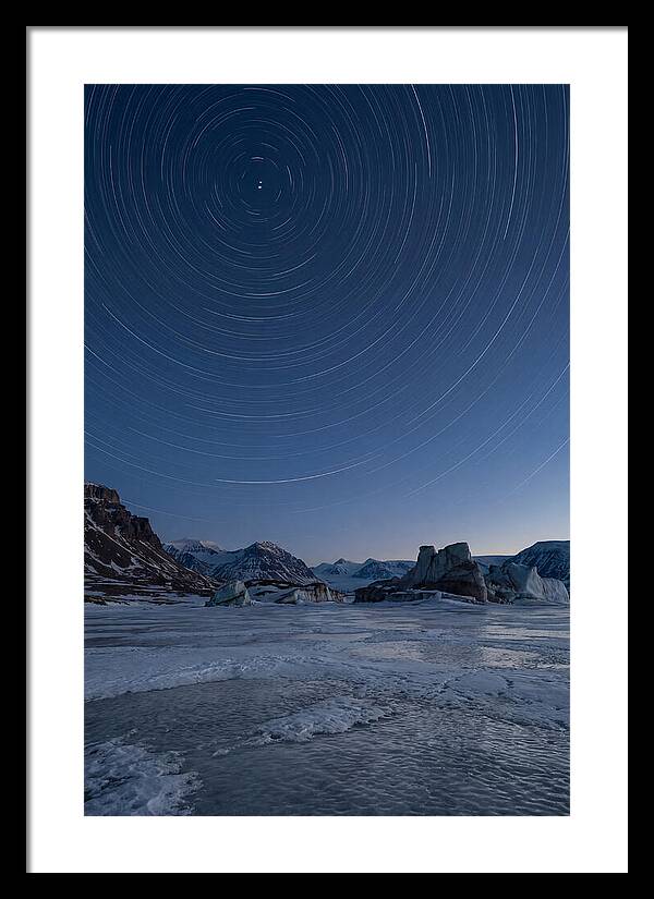 Celestial Star Trails Over Arctic Landscape
