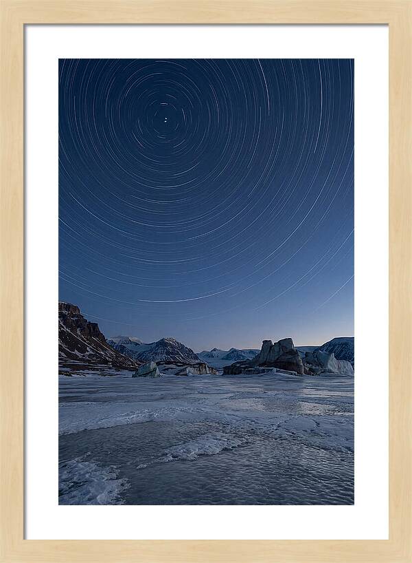 Celestial Star Trails Over Arctic Landscape