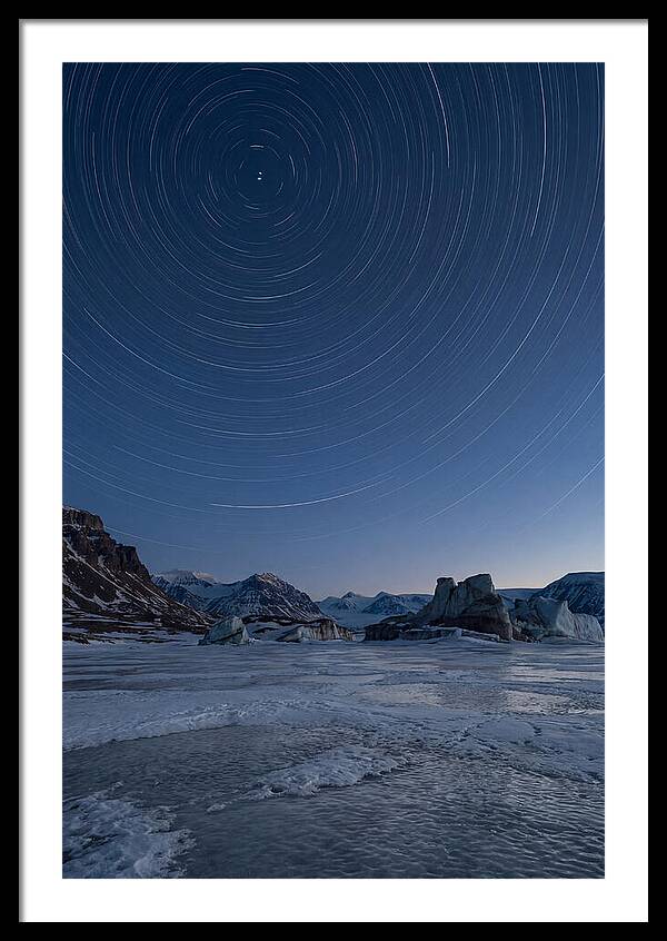 Celestial Star Trails Over Arctic Landscape