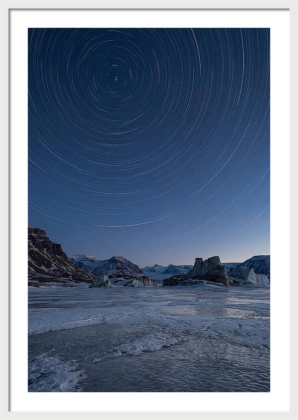Celestial Star Trails Over Arctic Landscape