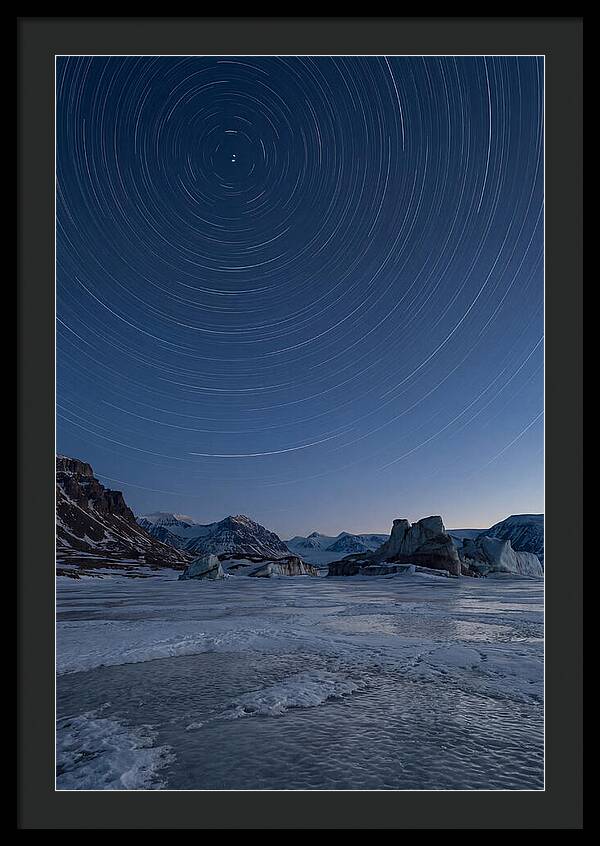 Celestial Star Trails Over Arctic Landscape