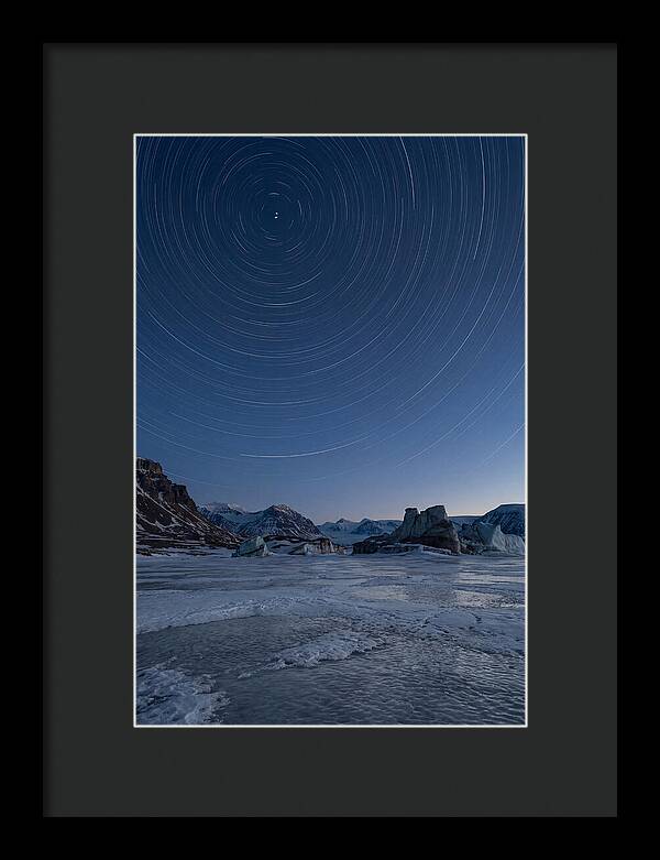 Celestial Star Trails Over Arctic Landscape