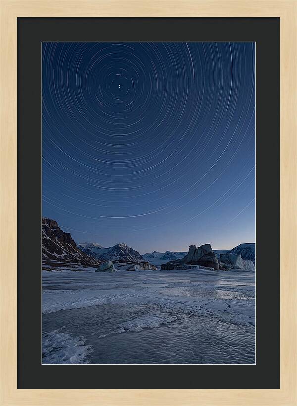 Celestial Star Trails Over Arctic Landscape