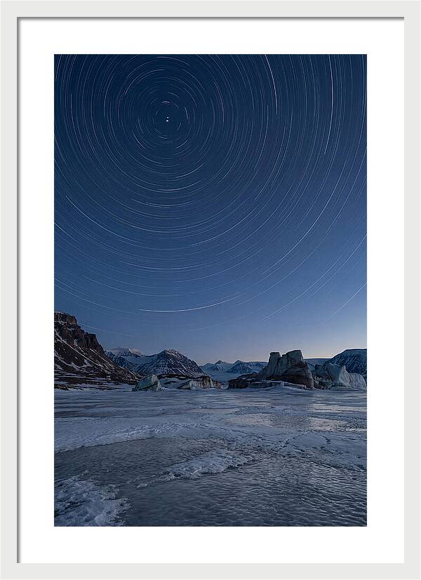 Celestial Star Trails Over Arctic Landscape