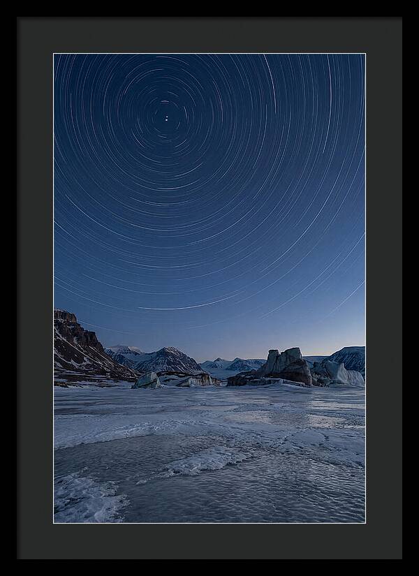 Celestial Star Trails Over Arctic Landscape