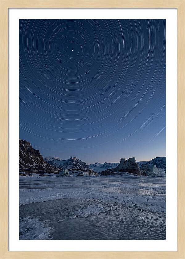 Celestial Star Trails Over Arctic Landscape