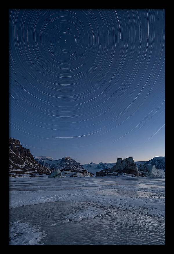 Celestial Star Trails Over Arctic Landscape