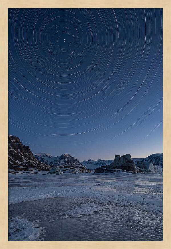 Celestial Star Trails Over Arctic Landscape