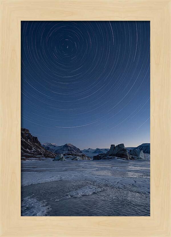 Celestial Star Trails Over Arctic Landscape