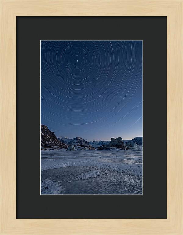 Celestial Star Trails Over Arctic Landscape