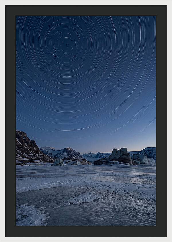 Celestial Star Trails Over Arctic Landscape