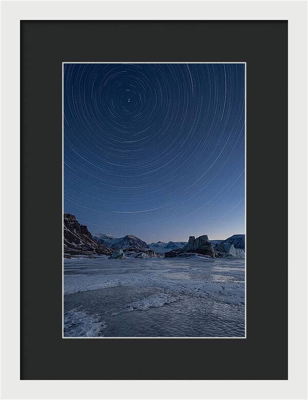 Celestial Star Trails Over Arctic Landscape