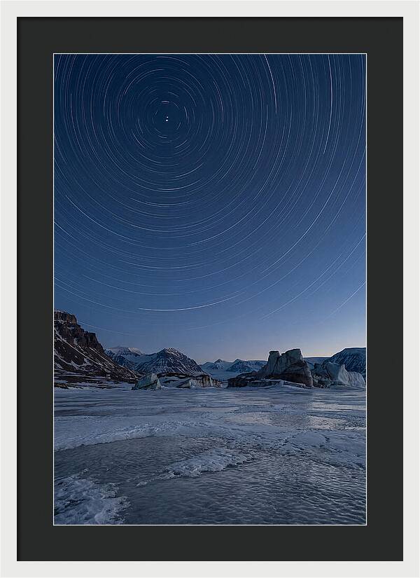 Celestial Star Trails Over Arctic Landscape