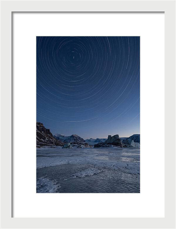 Celestial Star Trails Over Arctic Landscape