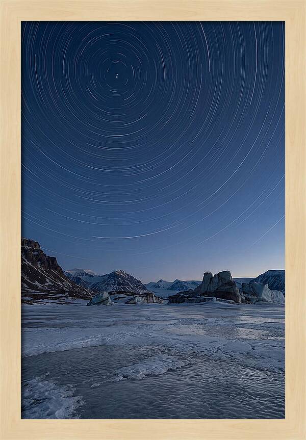 Celestial Star Trails Over Arctic Landscape