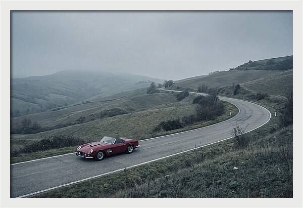Classic Red Ferrari On Winding Road