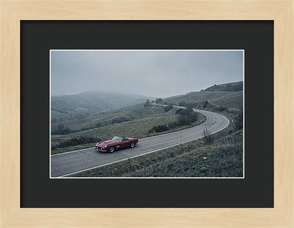 Classic Red Ferrari On Winding Road