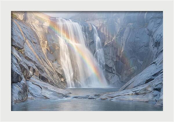 Cliff Face Waterfall With Rainbow