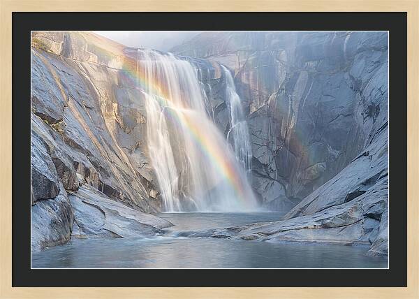 Cliff Face Waterfall With Rainbow