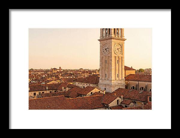 Clock Tower Above Red Tile Rooftops
