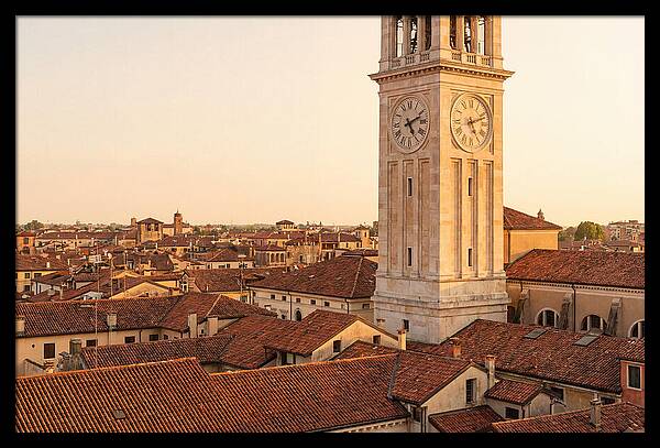 Clock Tower Above Red Tile Rooftops