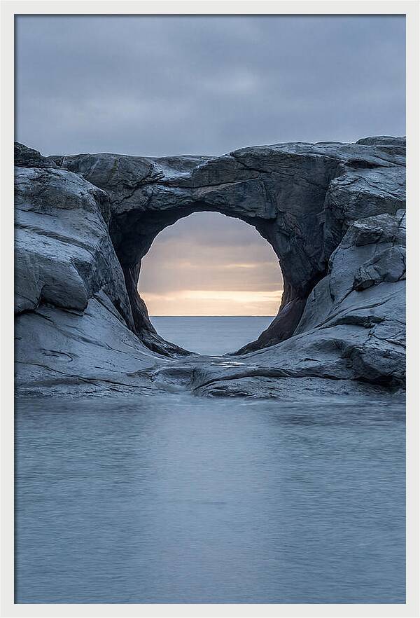 Coastal Rock Arch Framing Sunset