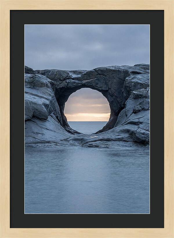 Coastal Rock Arch Framing Sunset