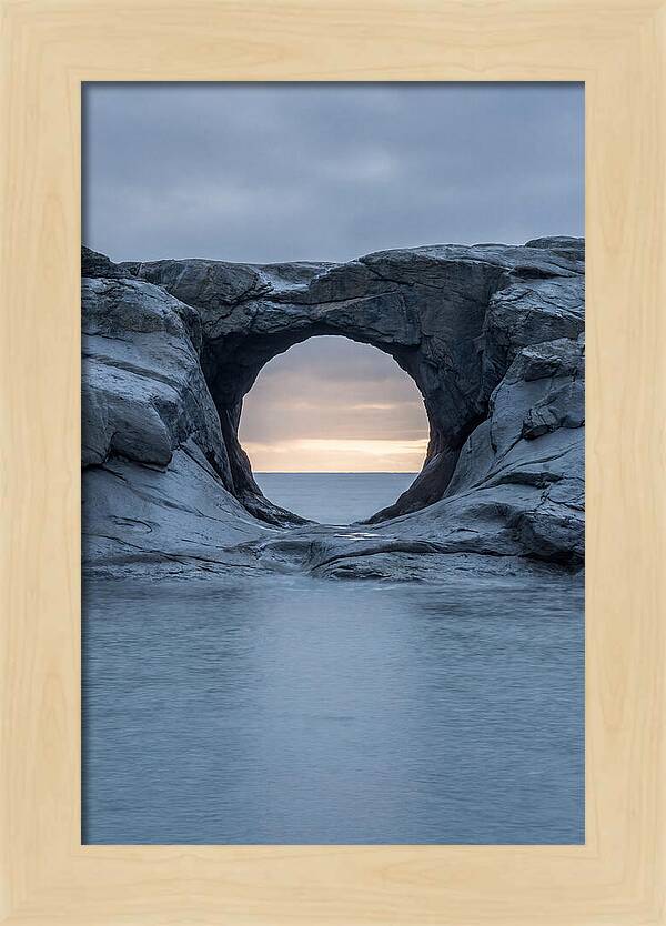 Coastal Rock Arch Framing Sunset
