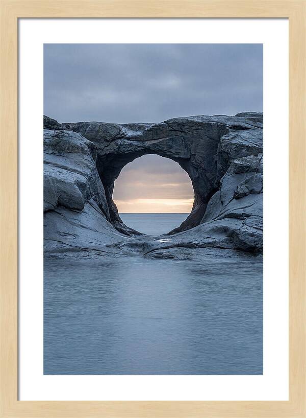 Coastal Rock Arch Framing Sunset
