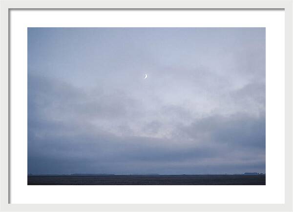 Crescent Moon In Twilight Sky