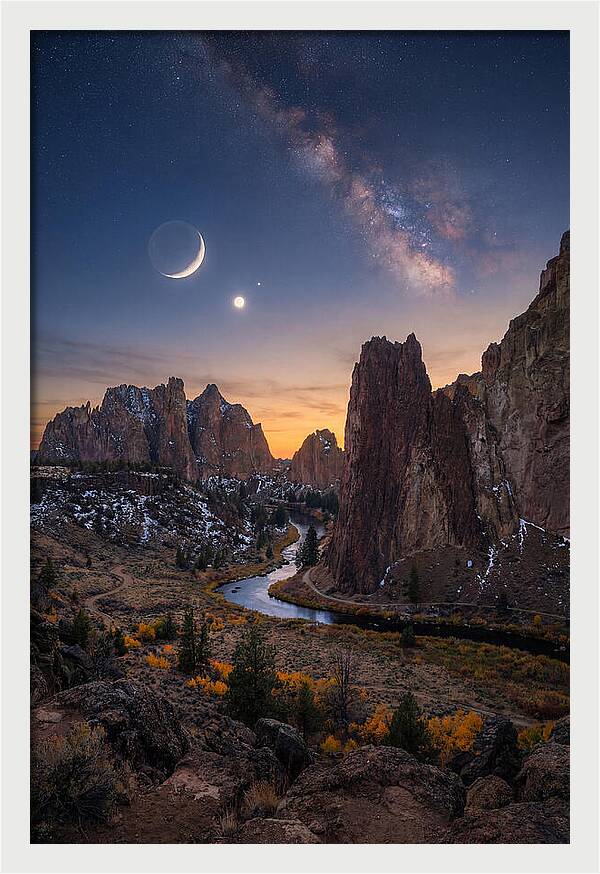 Crescent Moon Over Majestic Peaks