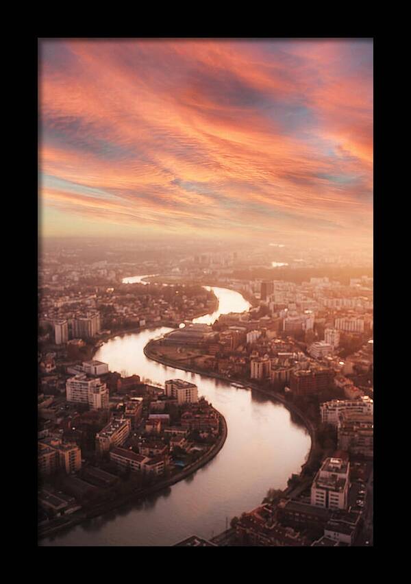 Curved River Through Cityscape