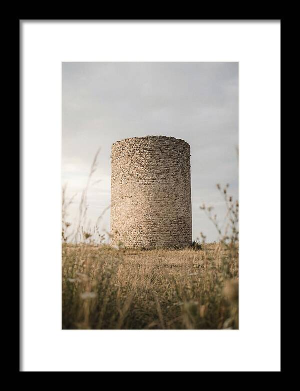 Cylindrical Stone Tower In Field