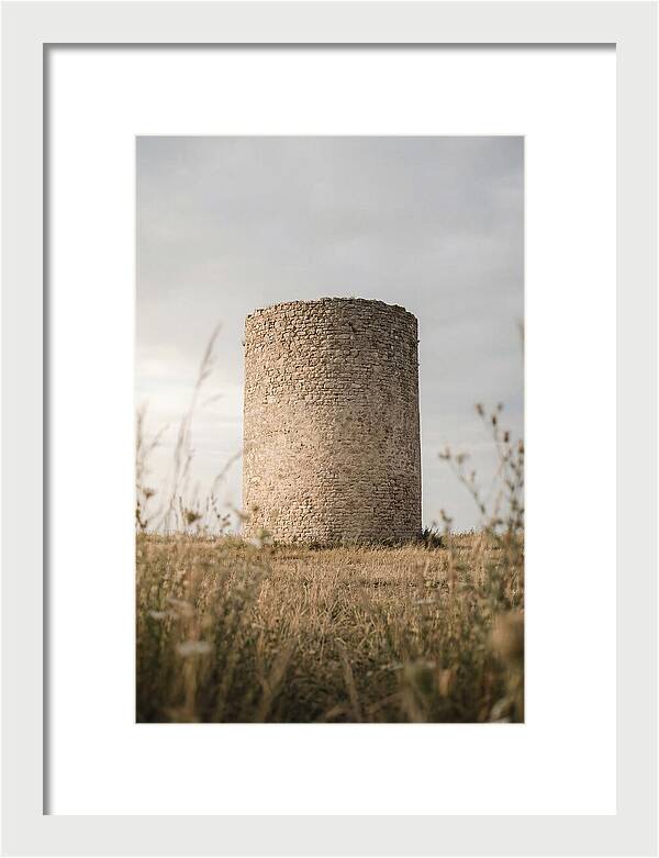 Cylindrical Stone Tower In Field