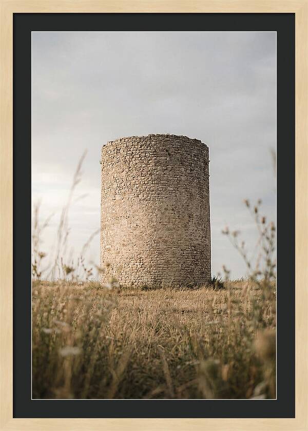 Cylindrical Stone Tower In Field