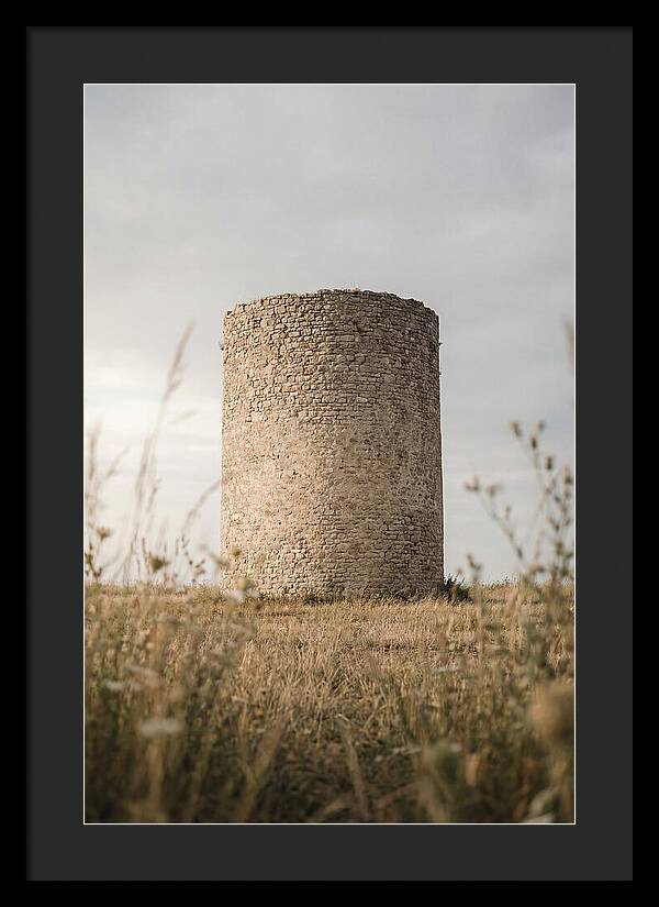 Cylindrical Stone Tower In Field