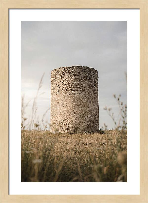 Cylindrical Stone Tower In Field