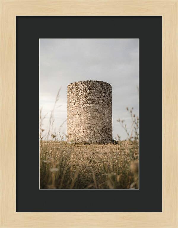 Cylindrical Stone Tower In Field