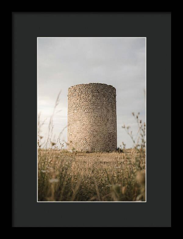 Cylindrical Stone Tower In Field