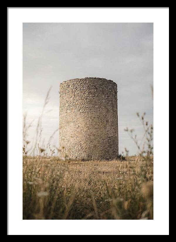Cylindrical Stone Tower In Field